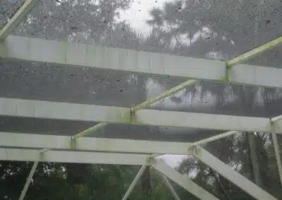 A metal structure with green paint on it.